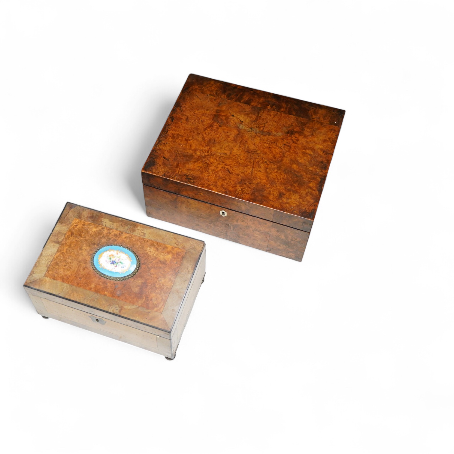 A 19th century burr walnut work box and a French burr wood and Sevres style porcelain mounted work box, 30.5cm wide x 14cm high.